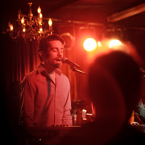 Bryan Elias Hull, singing into a microphone, Velour 2015.